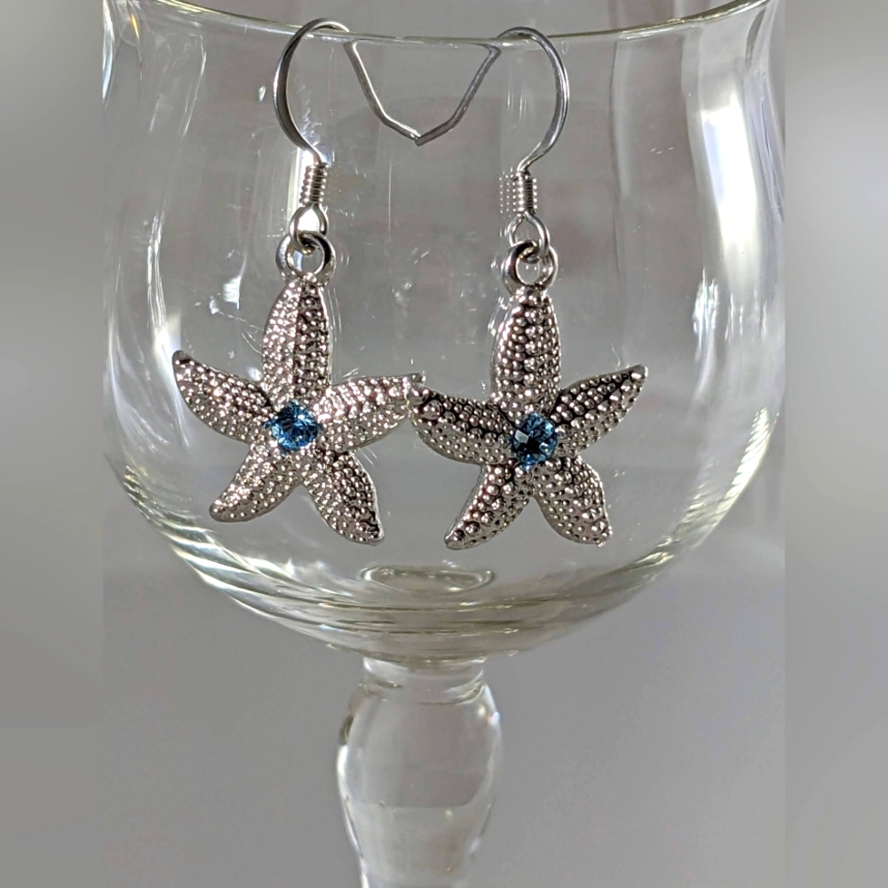 Sea Star earrings with blue Swarovski crystal. Made in the USA
